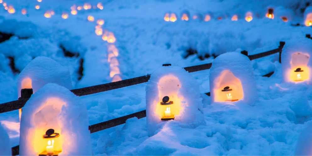 Row of candles inside snow sculptures