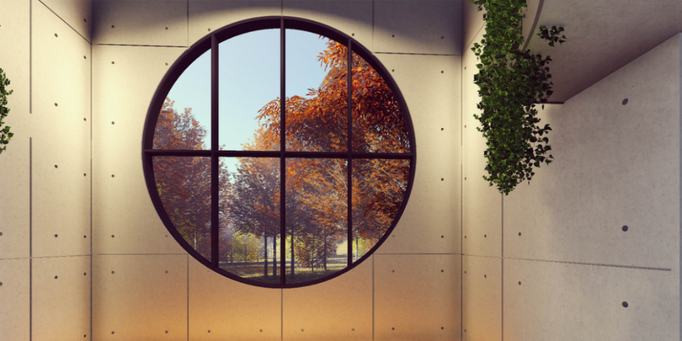 Room with a circular window with bars looking out at trees outside