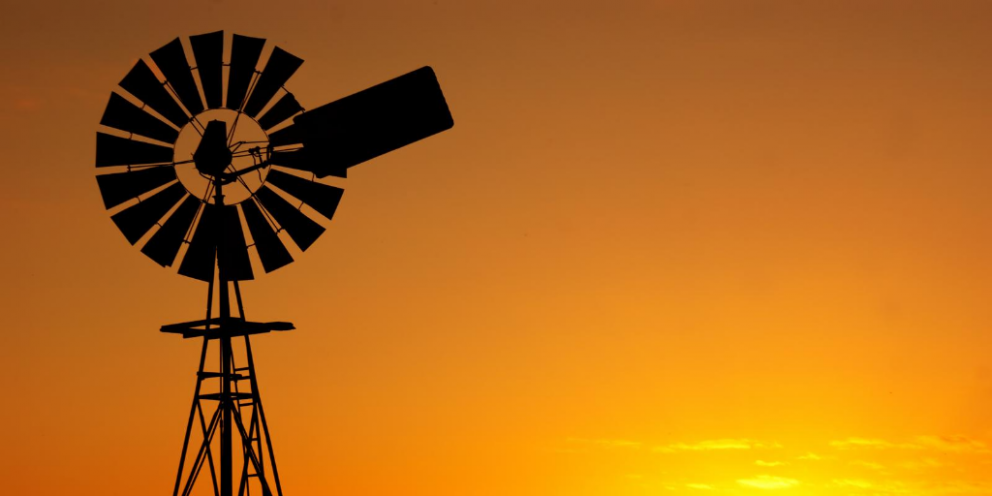 Outline of windmill in the sunset