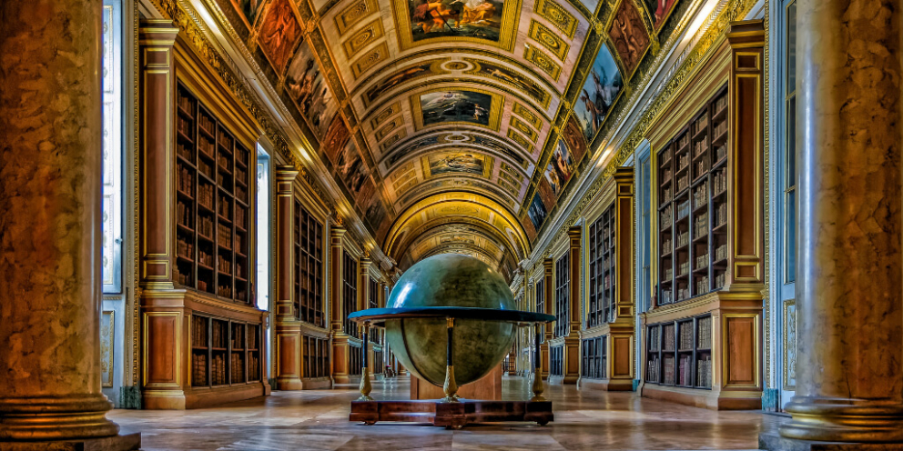 Colorful library with big globe in the center of the room