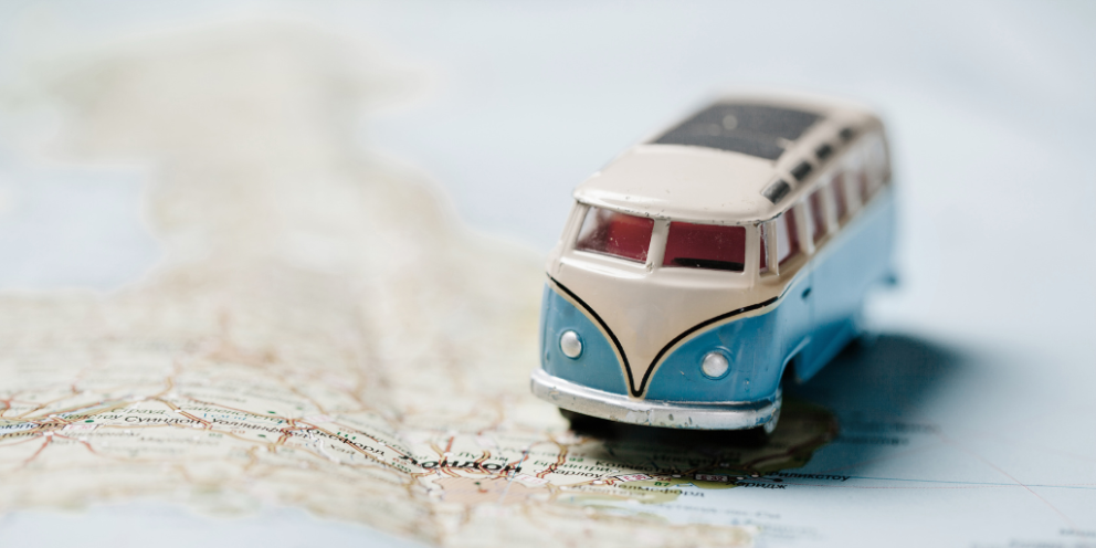 Small toy van on a paper map