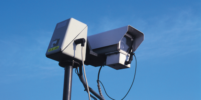 Surveillance camera with blue sky background