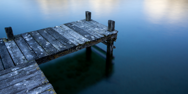 Wooden pier on clear blue water