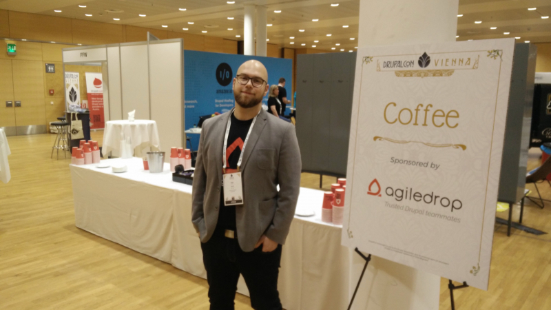 Iztok standing next to coffee stand sponsored by Agiledrop at DCEU Vienna 2017